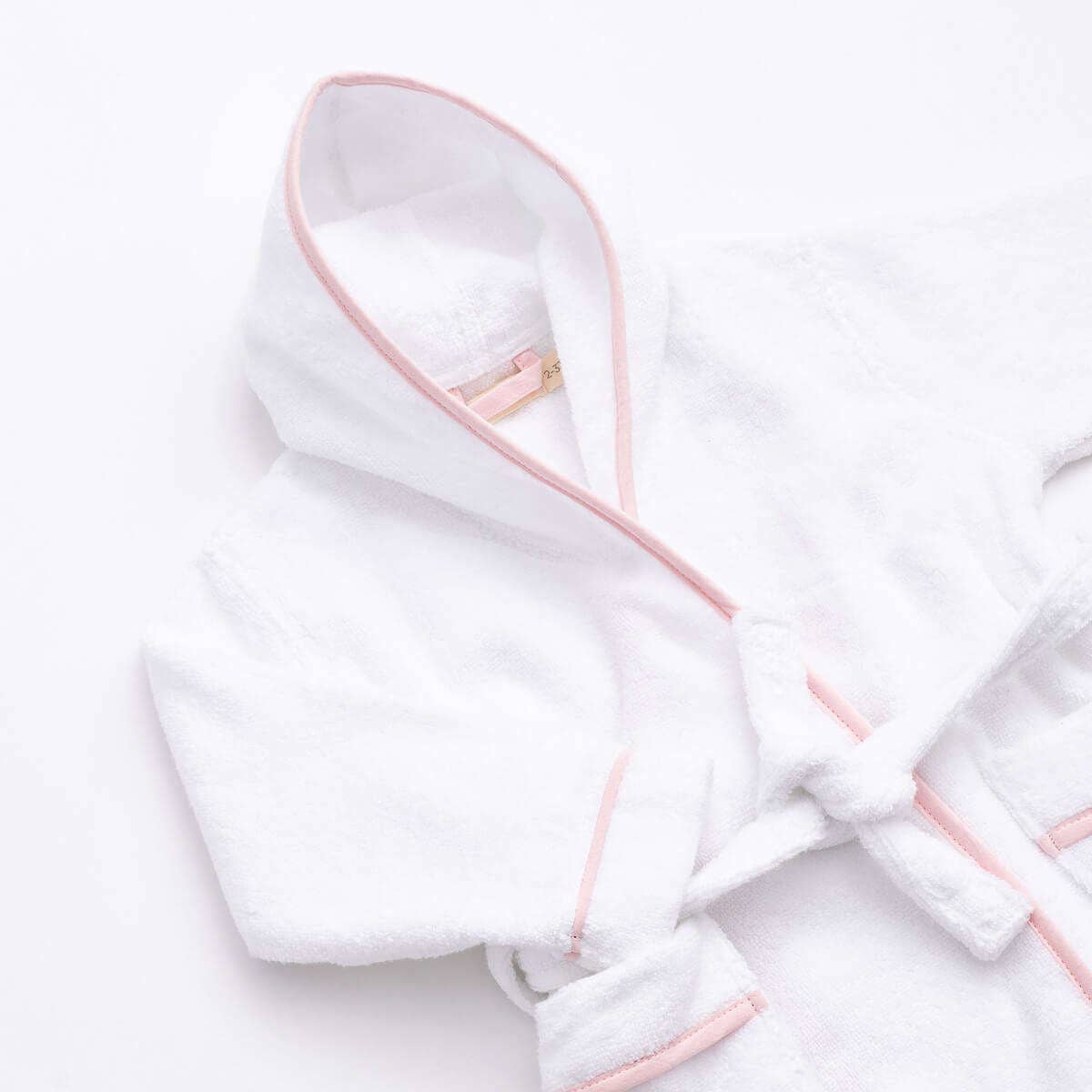 White robe with pink trim on a white background