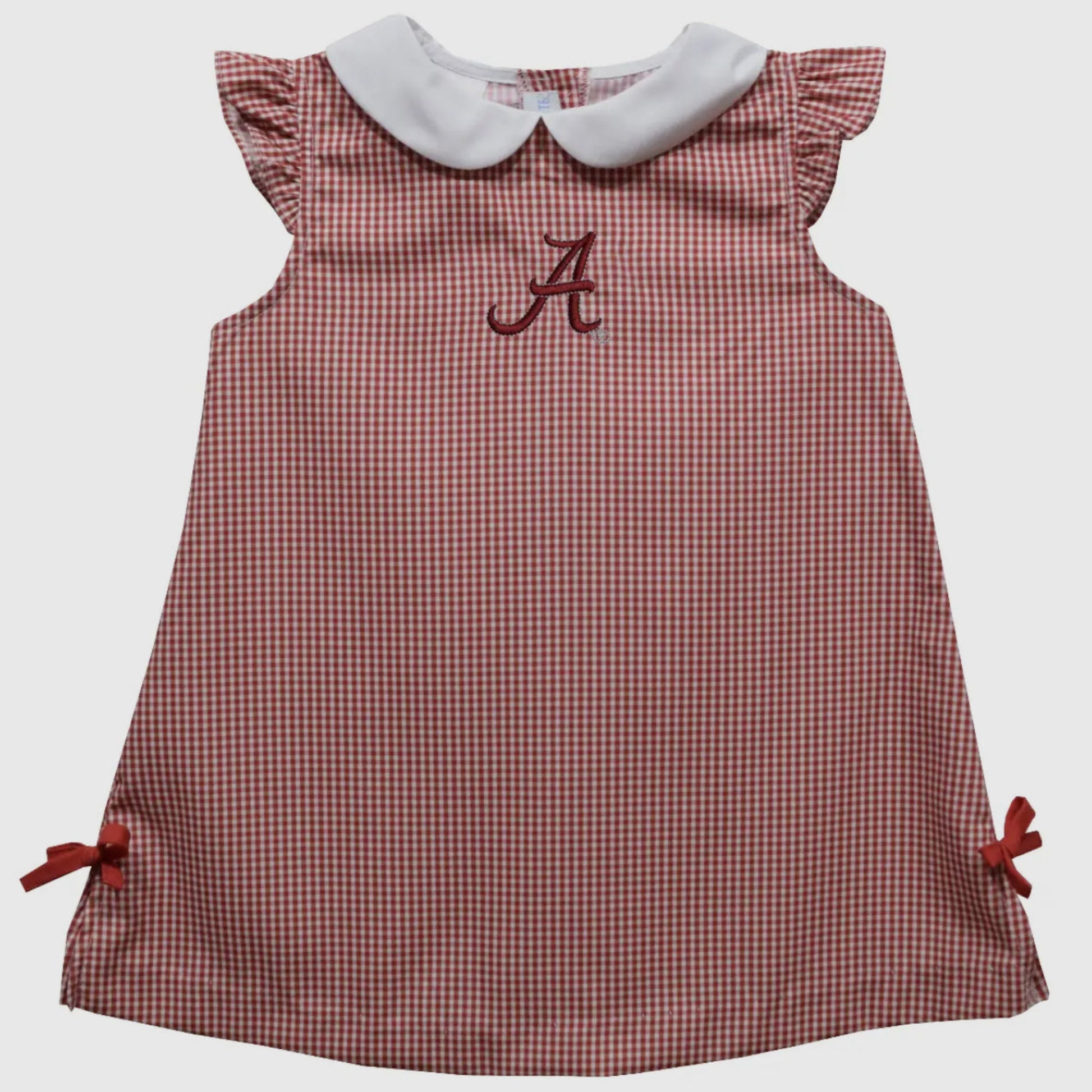 Red checkered dress with white collar and embroidered letter 'A' on a light gray background