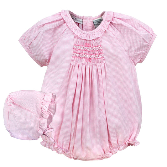 Pink baby bubble with ruffled sleeves and bottom on a white background