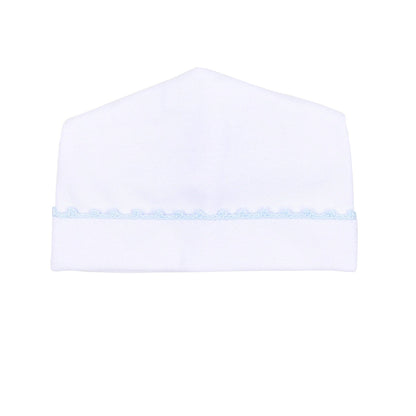 White baby hat with a light blue trim on a white background