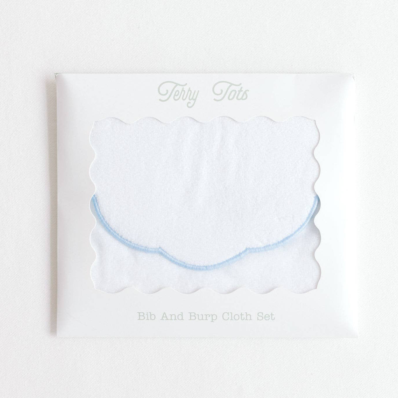 White cloud-shaped product with 'Bib & Burp Cloth Set’ text on a white background