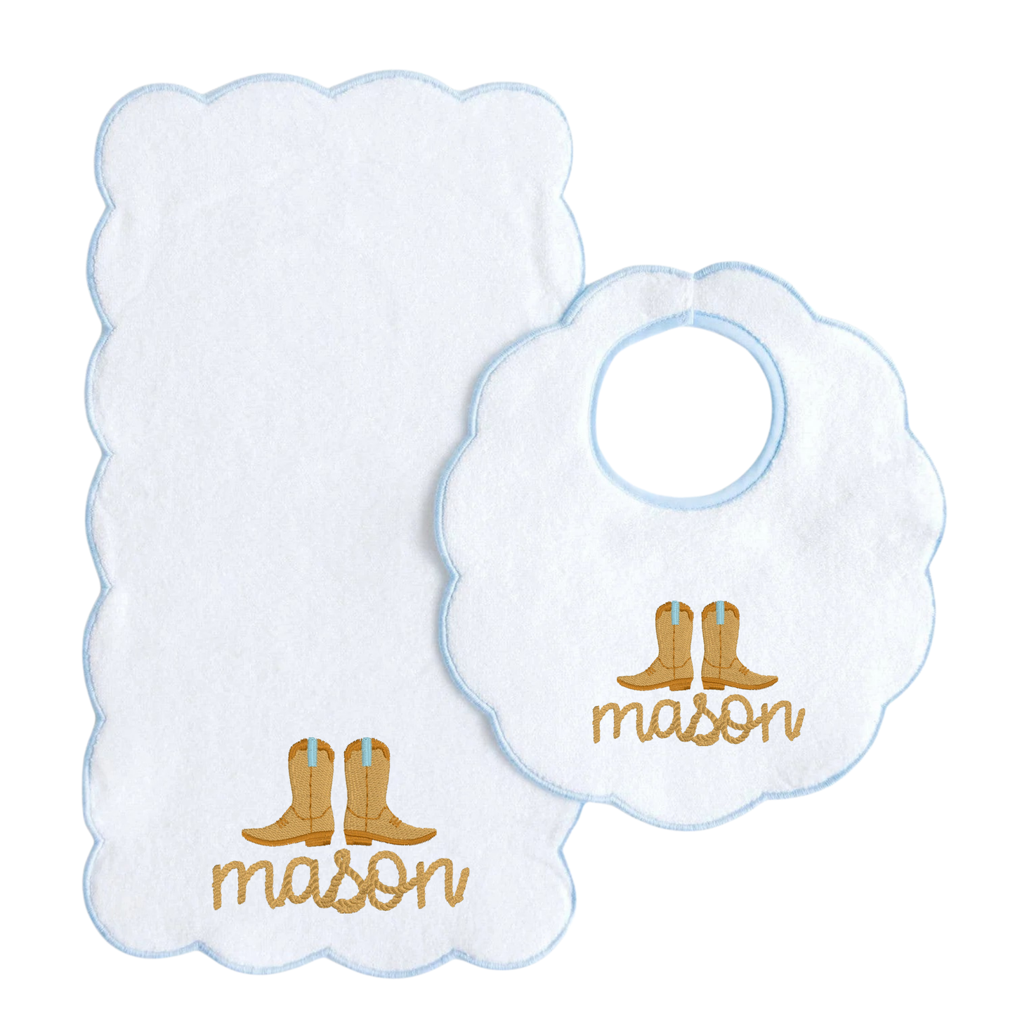 A white baby bib and matching washcloth set with scalloped edges, light blue borders, and gold embroidered cowboy boots and the name 'mason'.