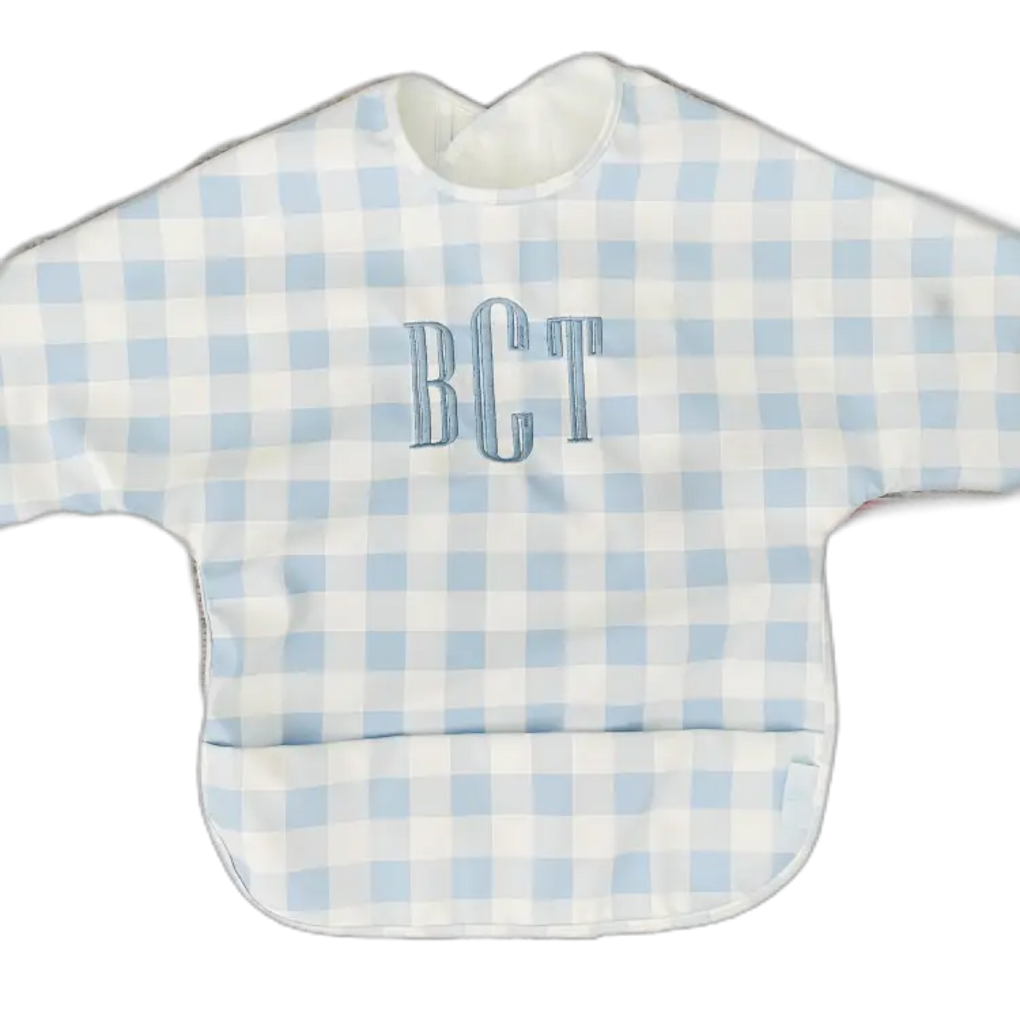 Baby bib with blue and white checkered pattern and 'BCT' monogram on a white background