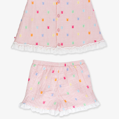Pink children's outfit with colorful patterns on a white background