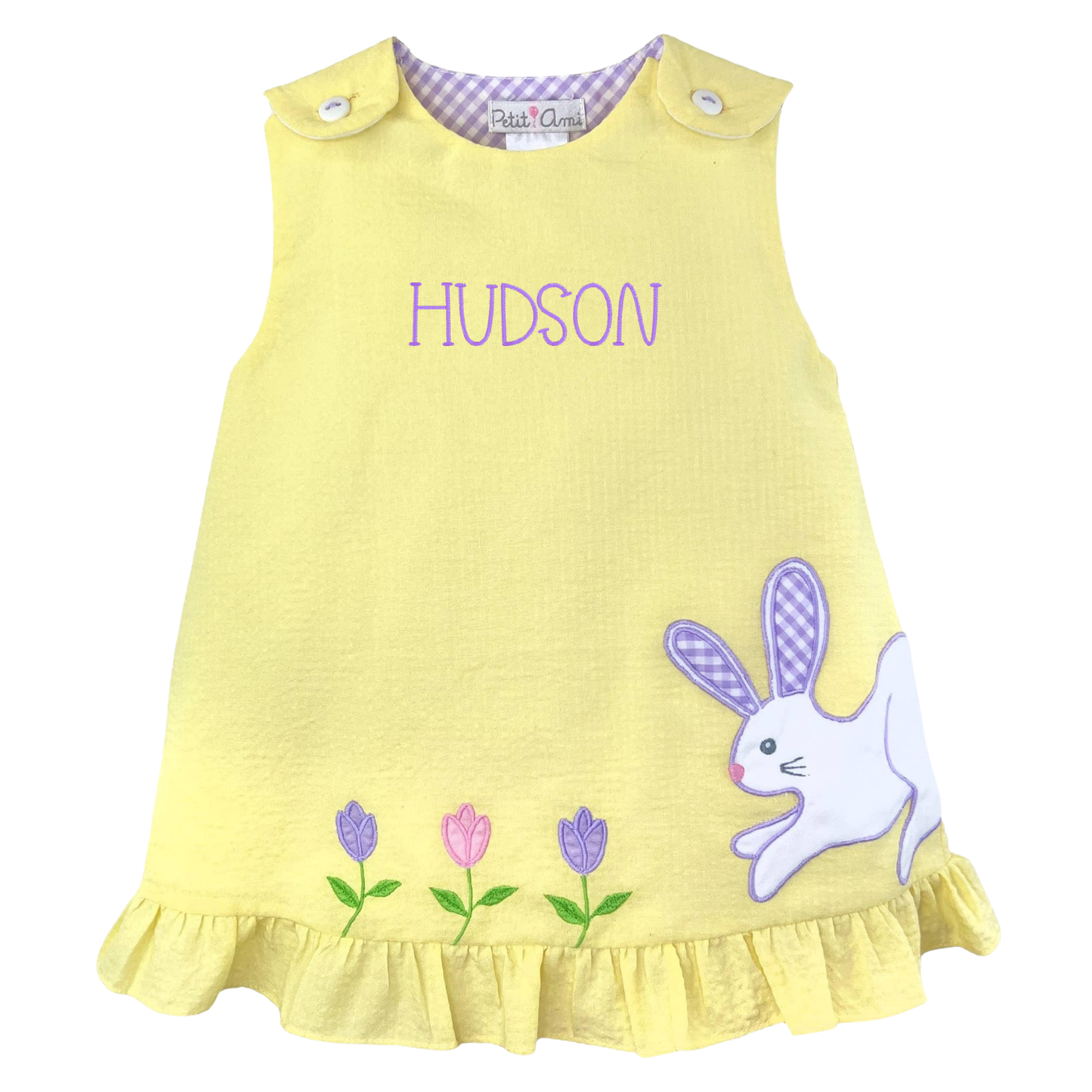 Yellow dress with bunny and flower design and 'Hudson' text on a white background