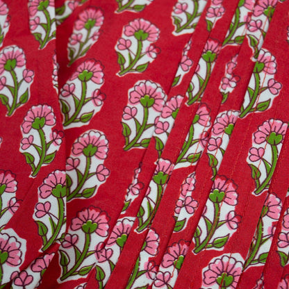 Red fabric with pink floral pattern