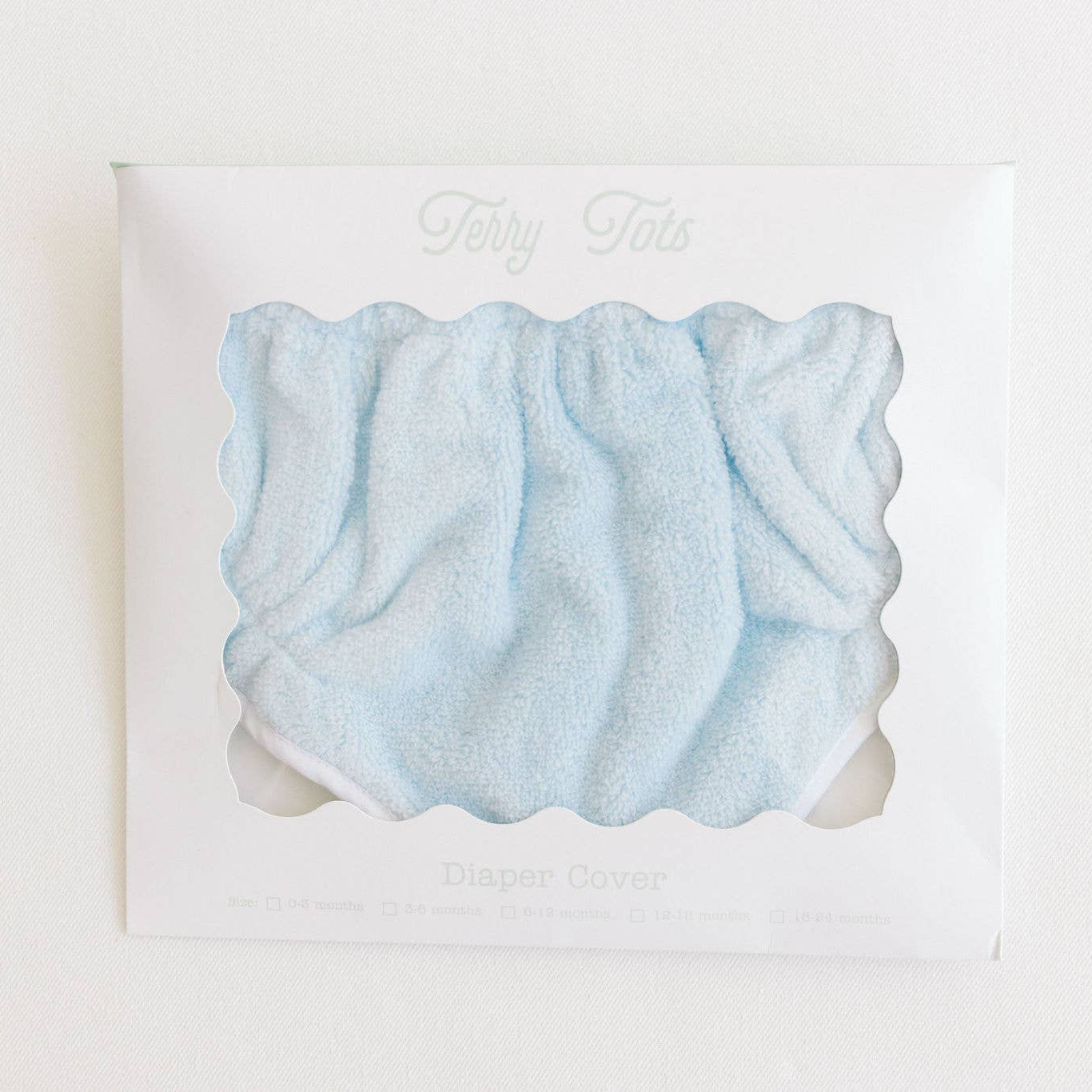 Light blue scrunchie on a white background with 'My Tots' branding.