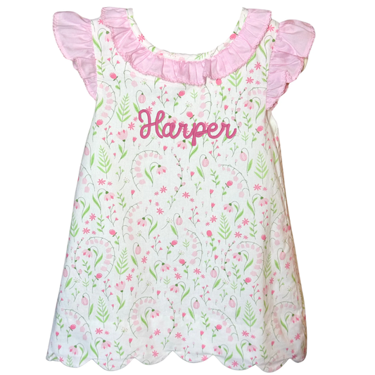 Floral dress with ruffled sleeves and 'Harper' printed on a white background