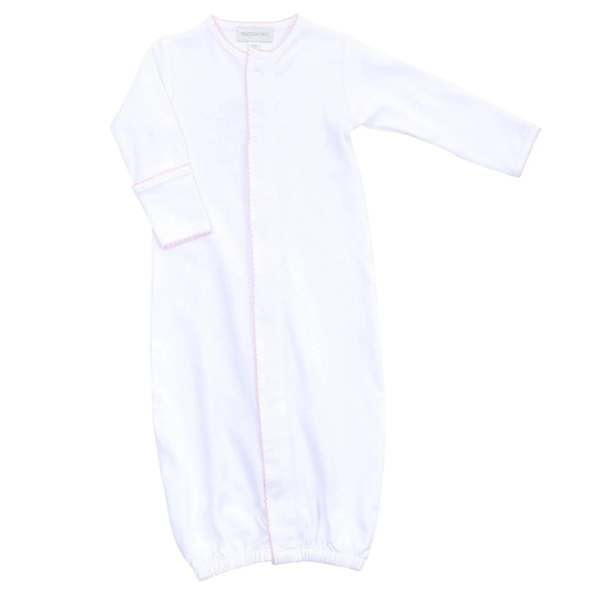 White baby gown with pink picot trim on a white background