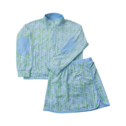 Children's blue and green patterned shirt and skirt set on a white background