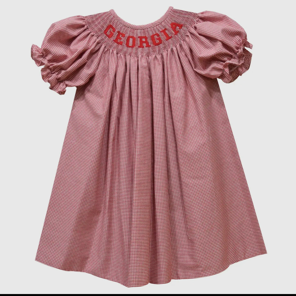 Pink checkered dress with 'Georgia' embroidery on a white background