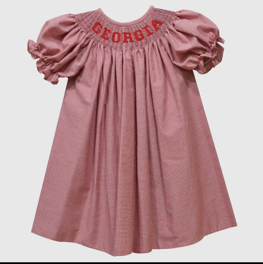 Pink checkered dress with 'Georgia' embroidery on a white background
