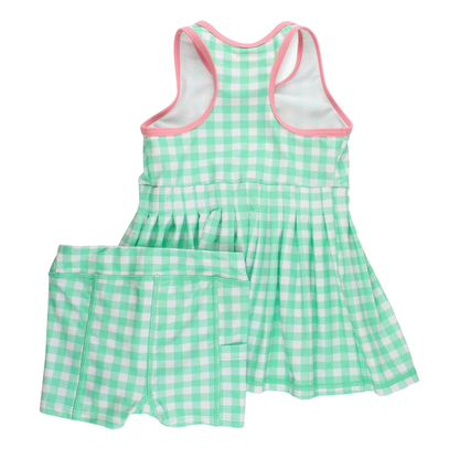 Green and white checkered dress with pink trim on a white background