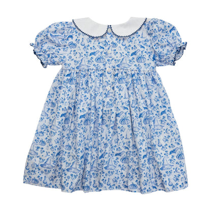 Children's dress with blue floral pattern on a white background