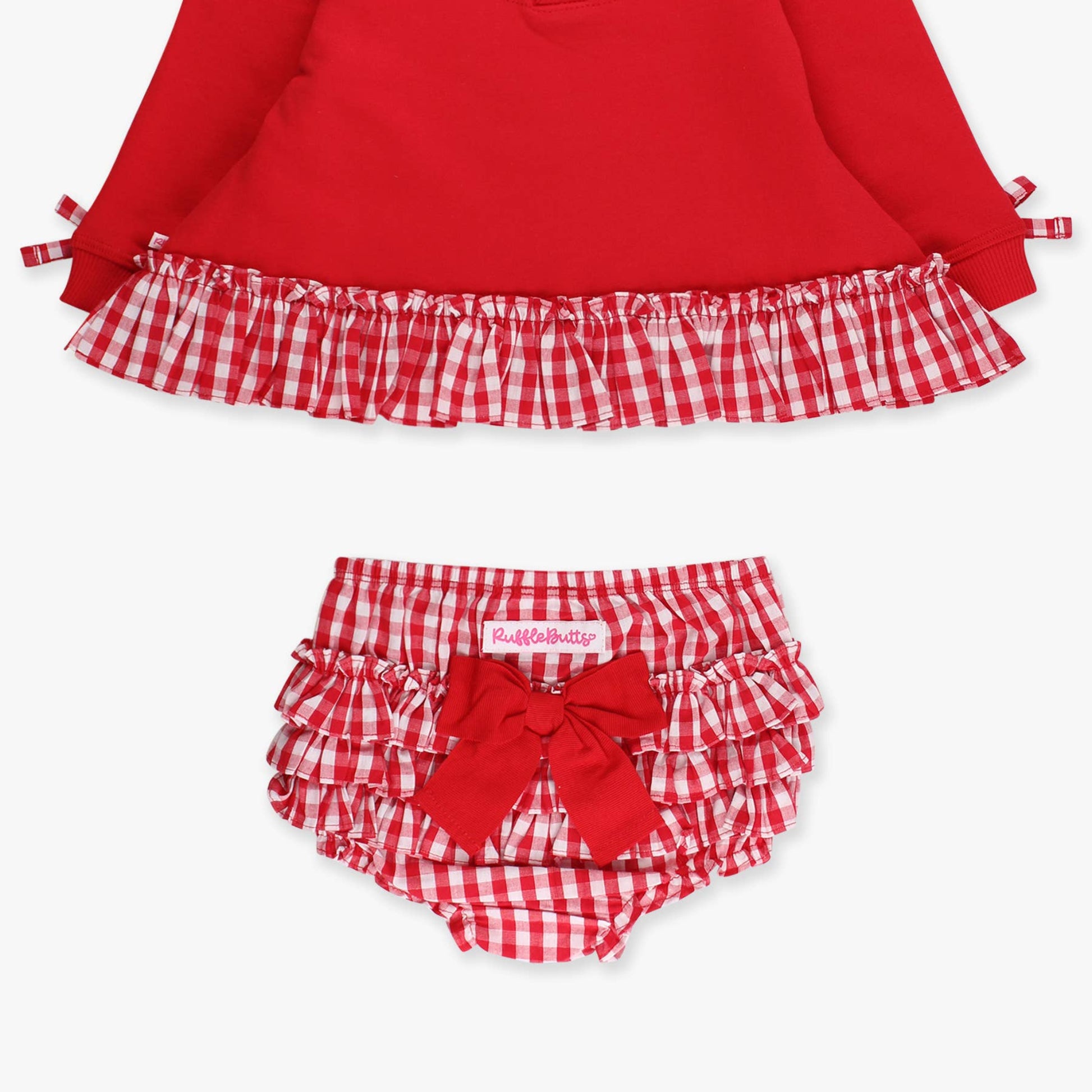 Red baby outfit with checkered ruffled top and matching bloomers on a white background