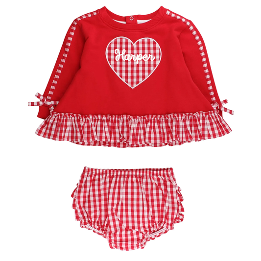 Red checkered outfit with a heart design on a white background