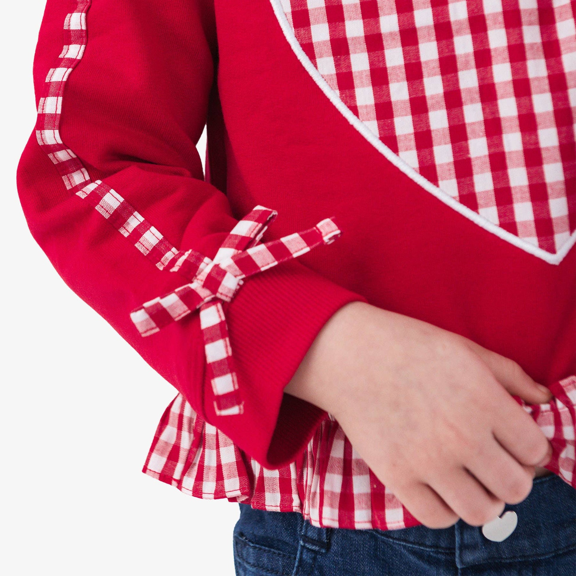 Red shirt with a large white heart design on a white background