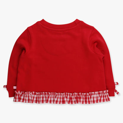 Red sweater with a checkered hem on a white background
