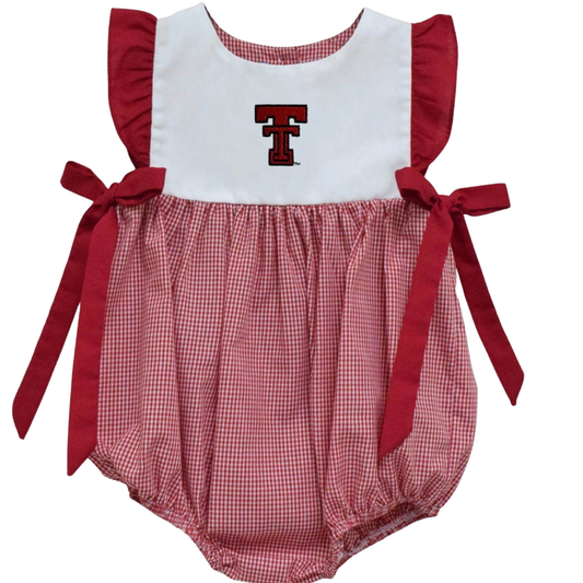 A baby romper featuring a white bib-style top with a red Texas Tech 'T' logo, red ruffle sleeves, and a red and white gingham bubble skirt with side bows, shown on a plain white background.