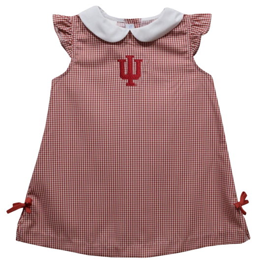 A toddler girl's dress featuring a red and white gingham pattern, a white Peter Pan collar, ruffled cap sleeves, and a red embroidered 'IU' logo on the chest. The dress is shown flat against a solid white background.