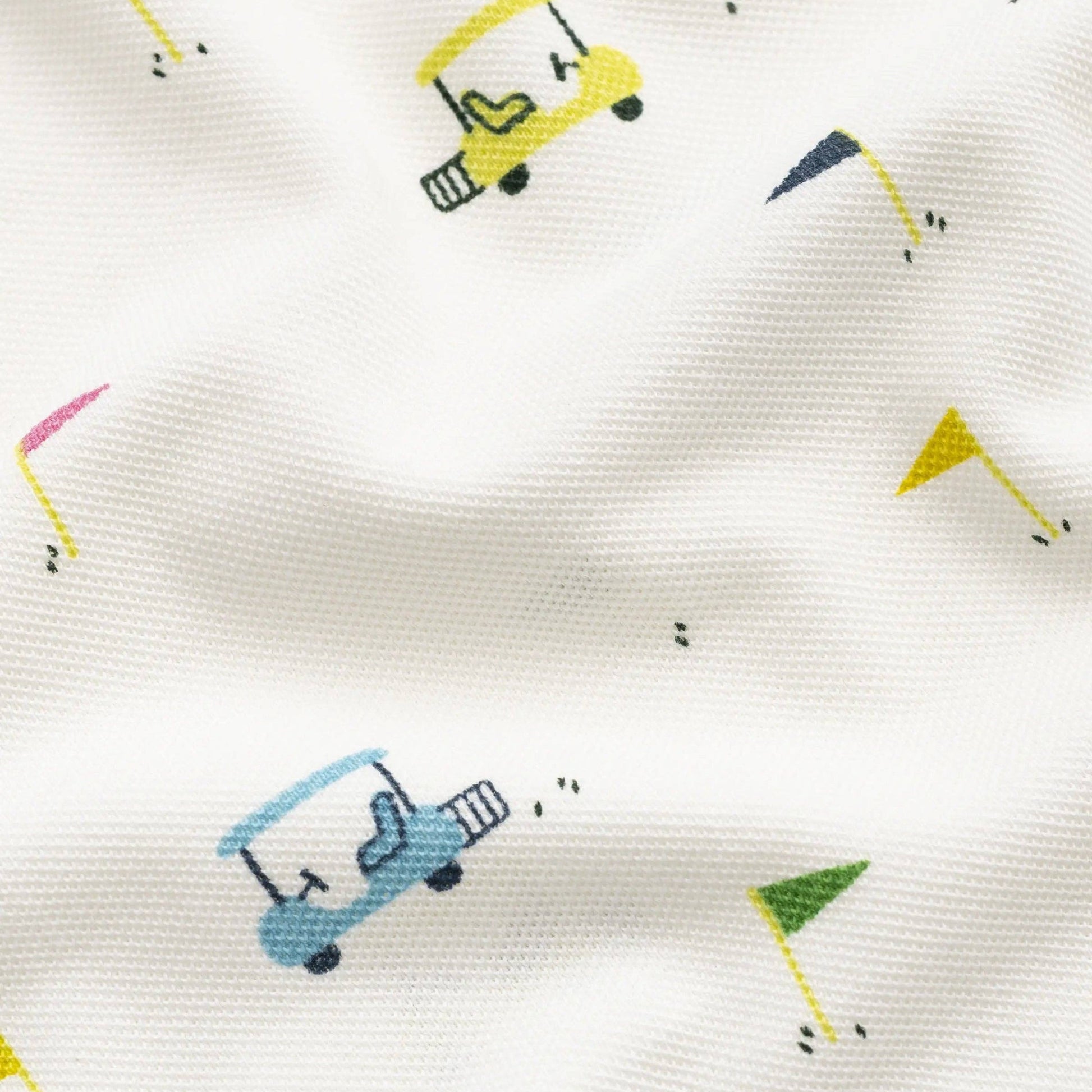 Pattern of colorful golf carts on a white fabric background
