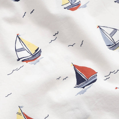 Pattern of colorful sailboats on a white background