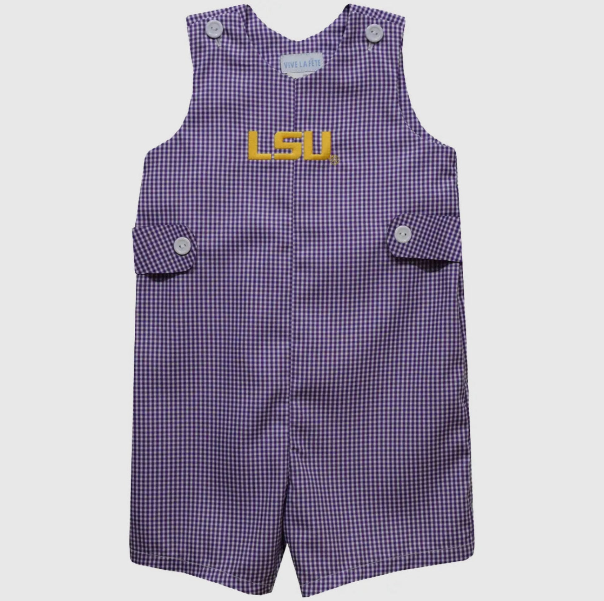 Purple checkered romper with a yellow label on a white background