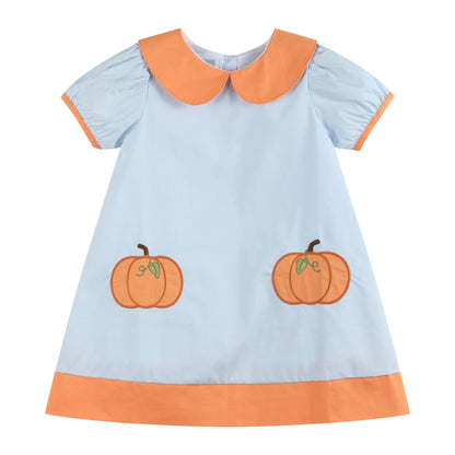 A baby girl's short-sleeve dress in light blue with an orange Peter Pan collar, orange sleeve trim, an orange hem, and two embroidered orange pumpkins on the front.