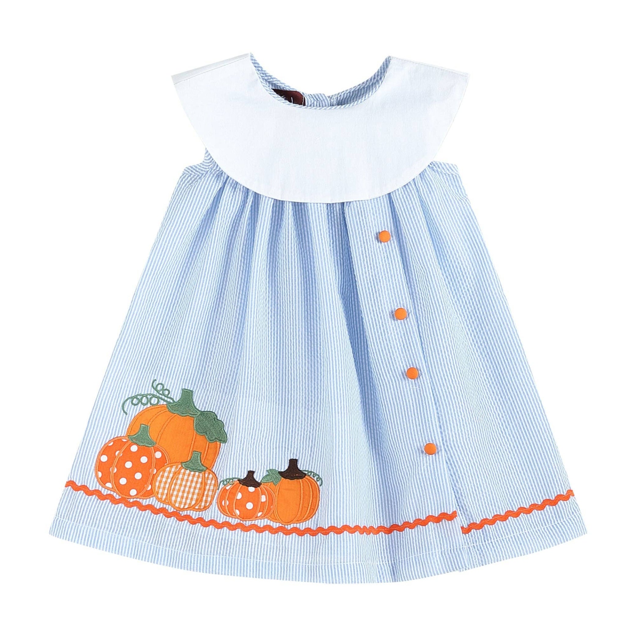 Children's dress with blue and white checkered pattern and orange pumpkins on a white background