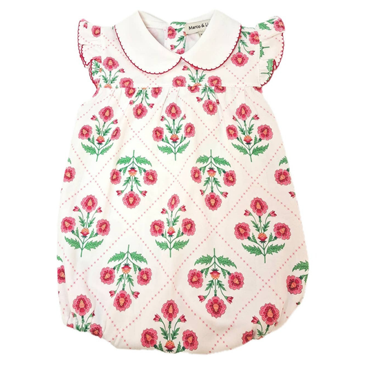 Floral patterned baby outfit with a white collar on a white background