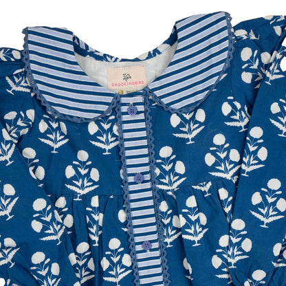 Blue dress with white floral pattern and striped collar on a white background
