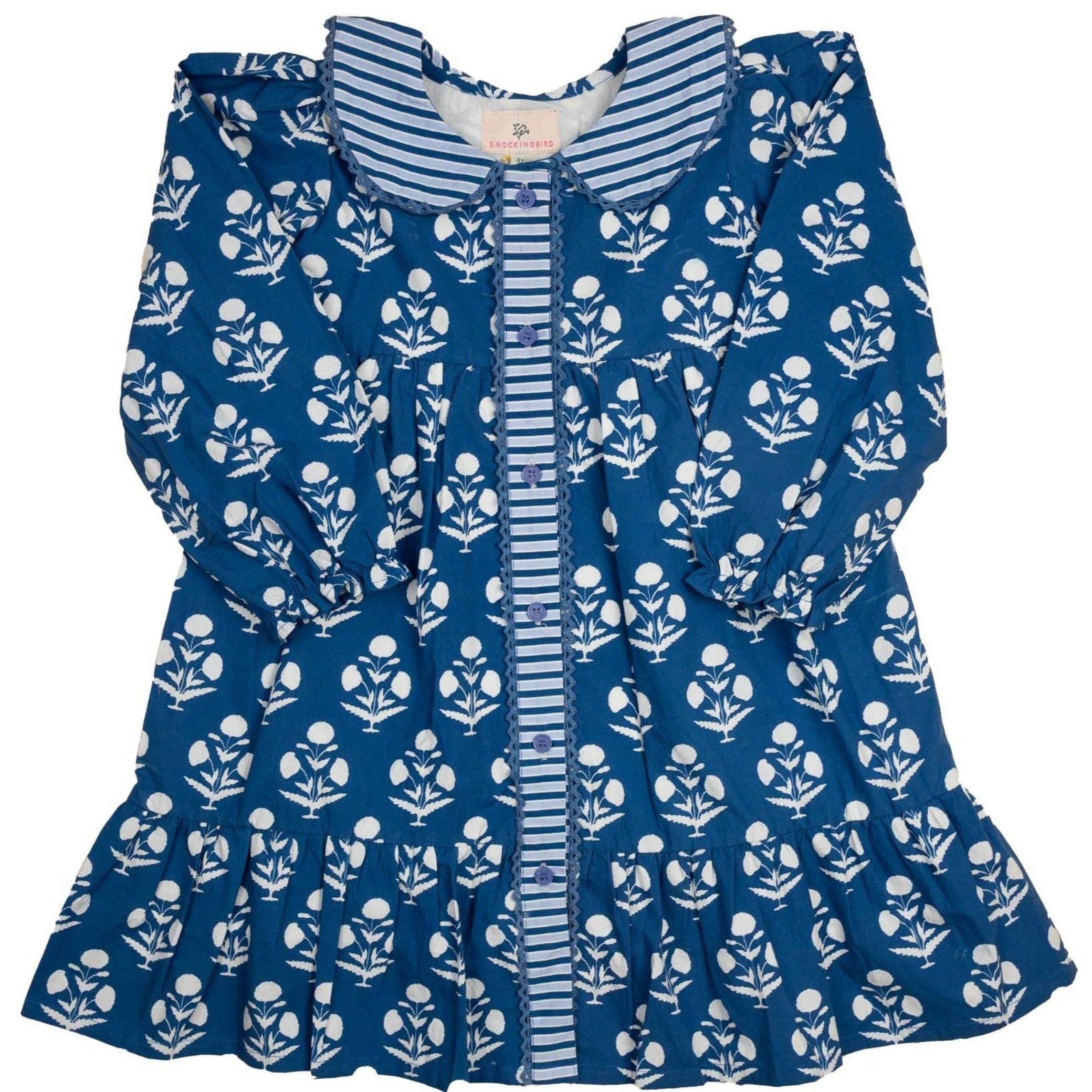 Blue dress with white floral pattern on a white background