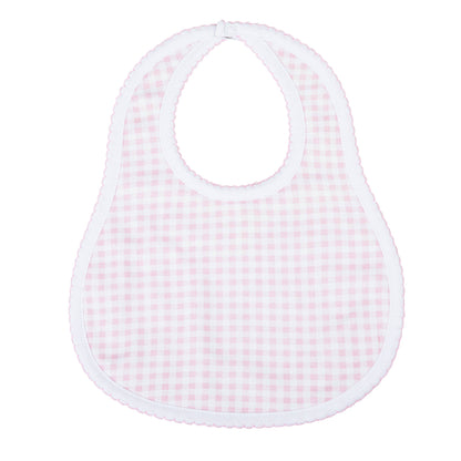 Pink checkered baby bib on a white background