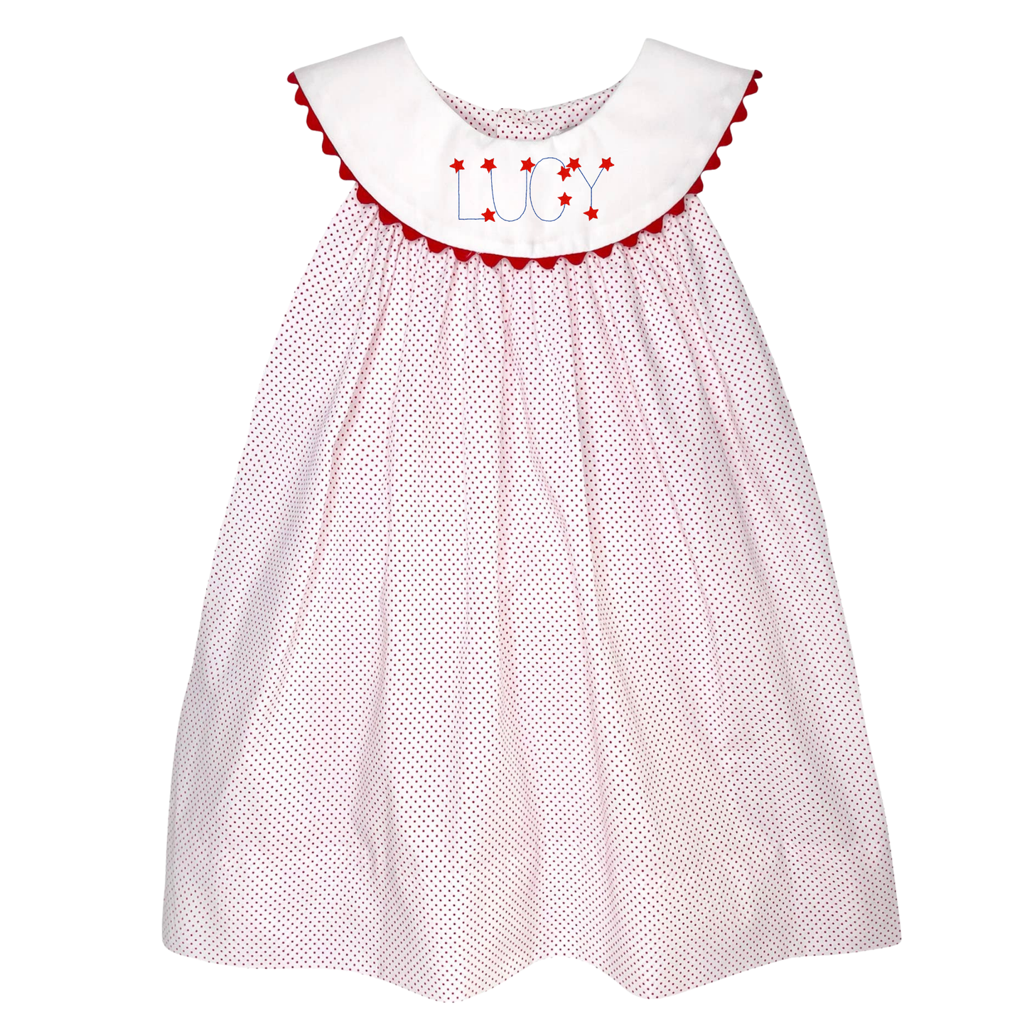 White dress with red polka dots and embroidered name on a white background