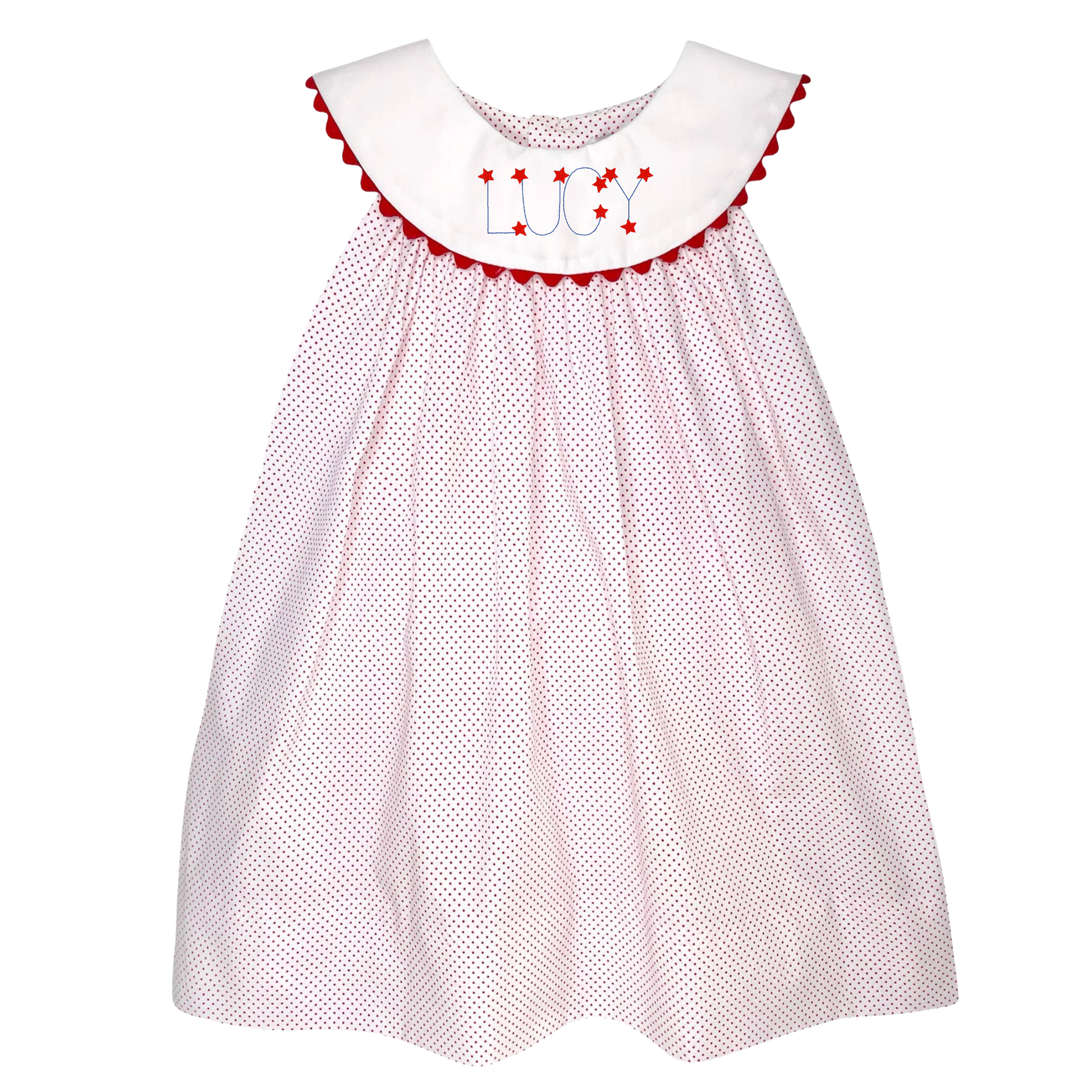 White dress with red polka dots and embroidered name on a white background