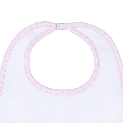 White bib with pink trim on a white background
