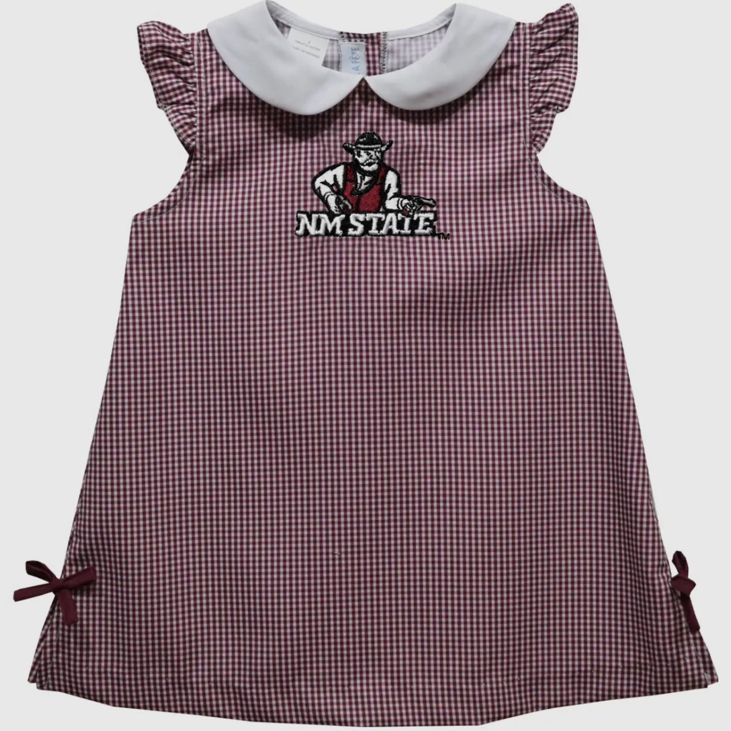Checkered dress with embroidered logo on a light gray background