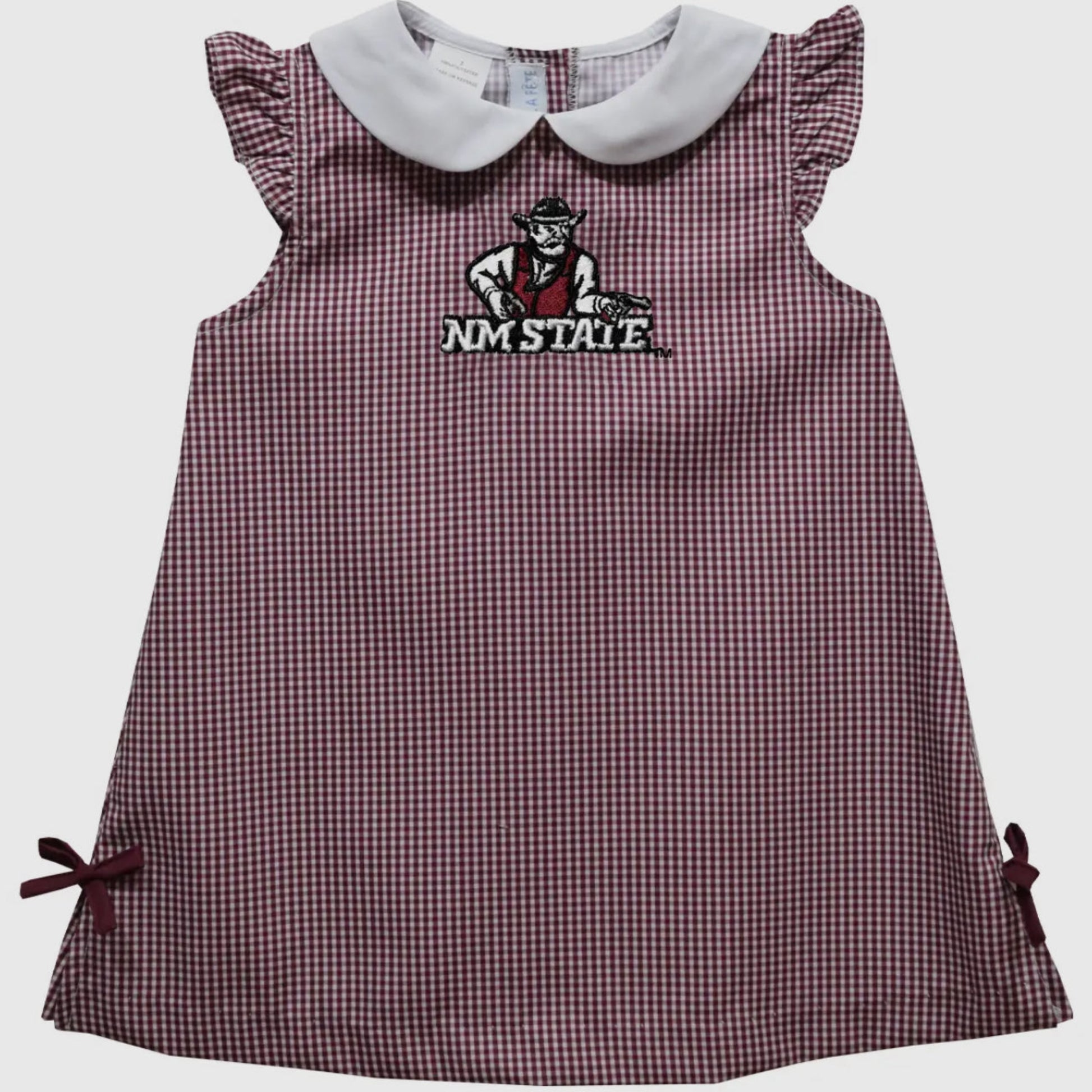 Checkered dress with embroidered logo on a light gray background