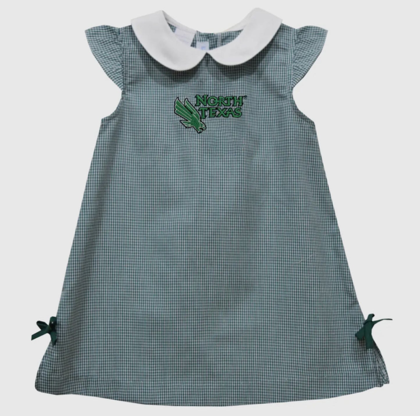Green checkered dress with white collar and 'North Texas' embroidery on a light gray background