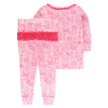 Pink floral pajama set with ruffled details on a white background