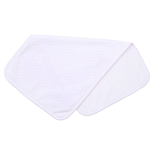 white burp cloth with pink dots on white background