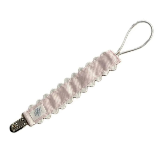 Pink ribbed lanyard with a metal clip on a white background