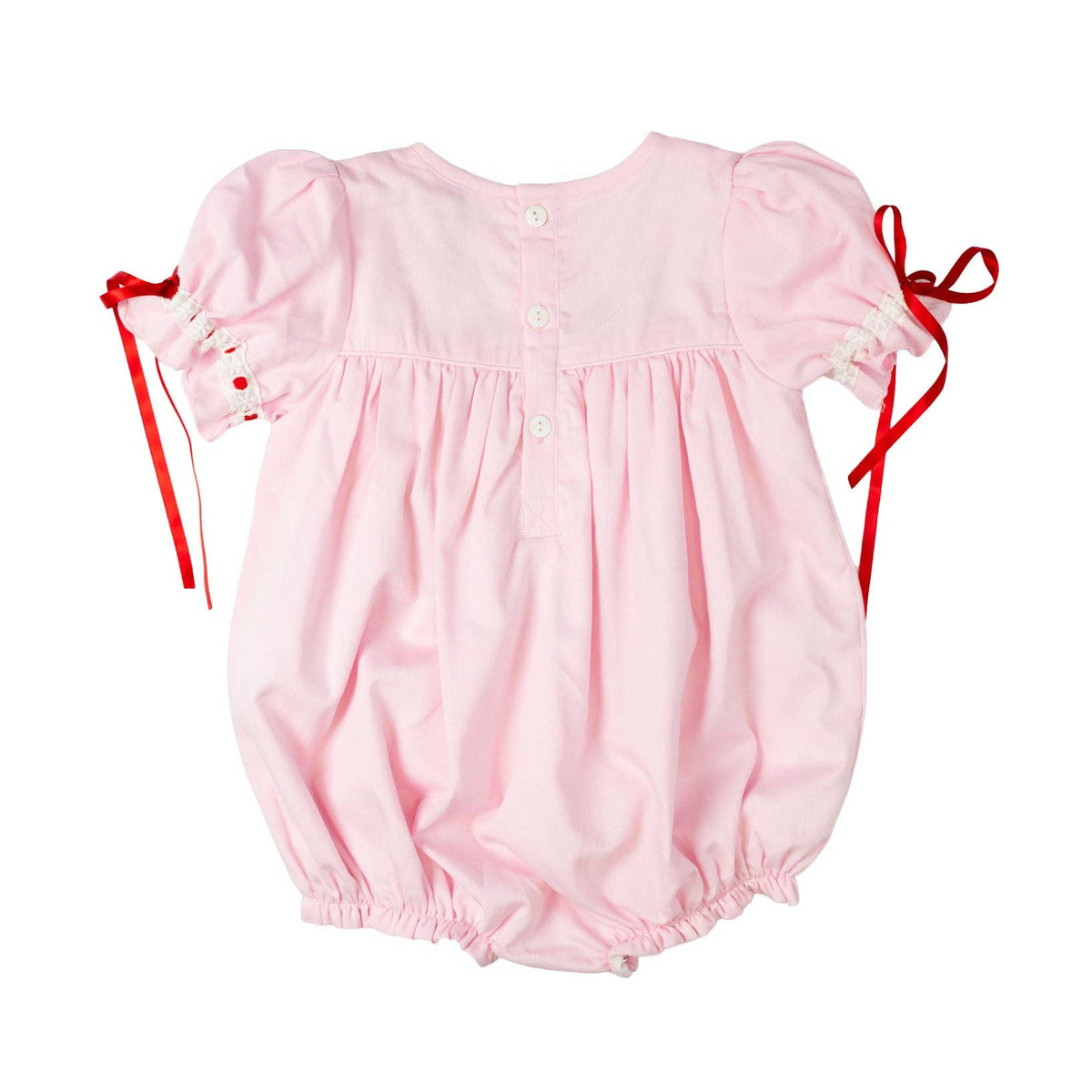 Pink baby romper with red straps on a white background