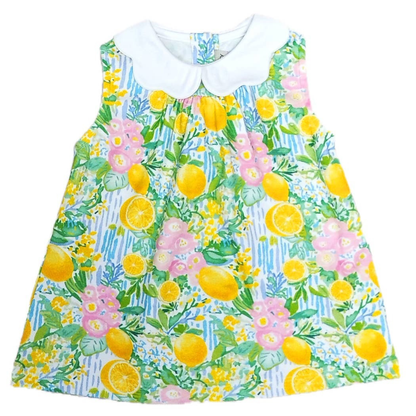 Children's dress with lemon and floral pattern on a white background