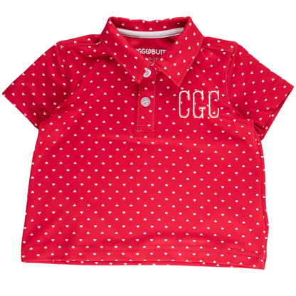 Red polo shirt with white heart pattern and 'GGC' initials on a white background
