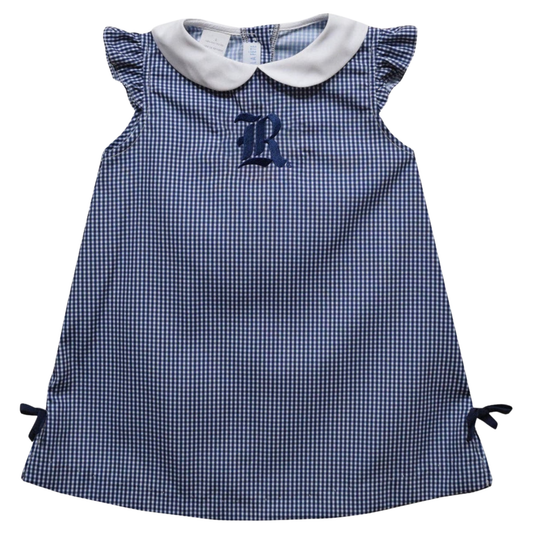 A long-sleeve baby dress with a light blue and white gingham pattern and an orange pumpkin print, shown against a plain white background.