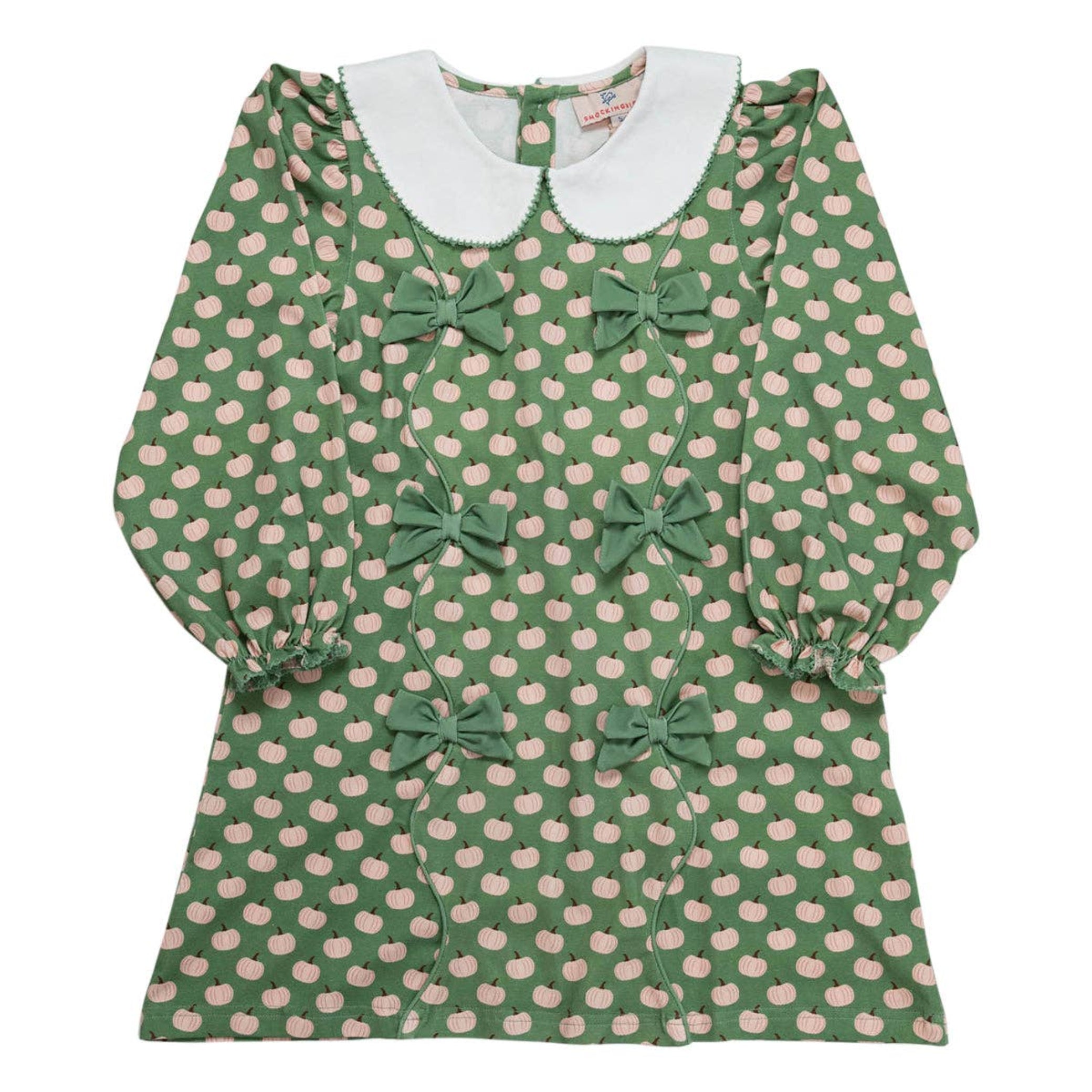 Green dress with pink pumpkin pattern and white collar on a white background