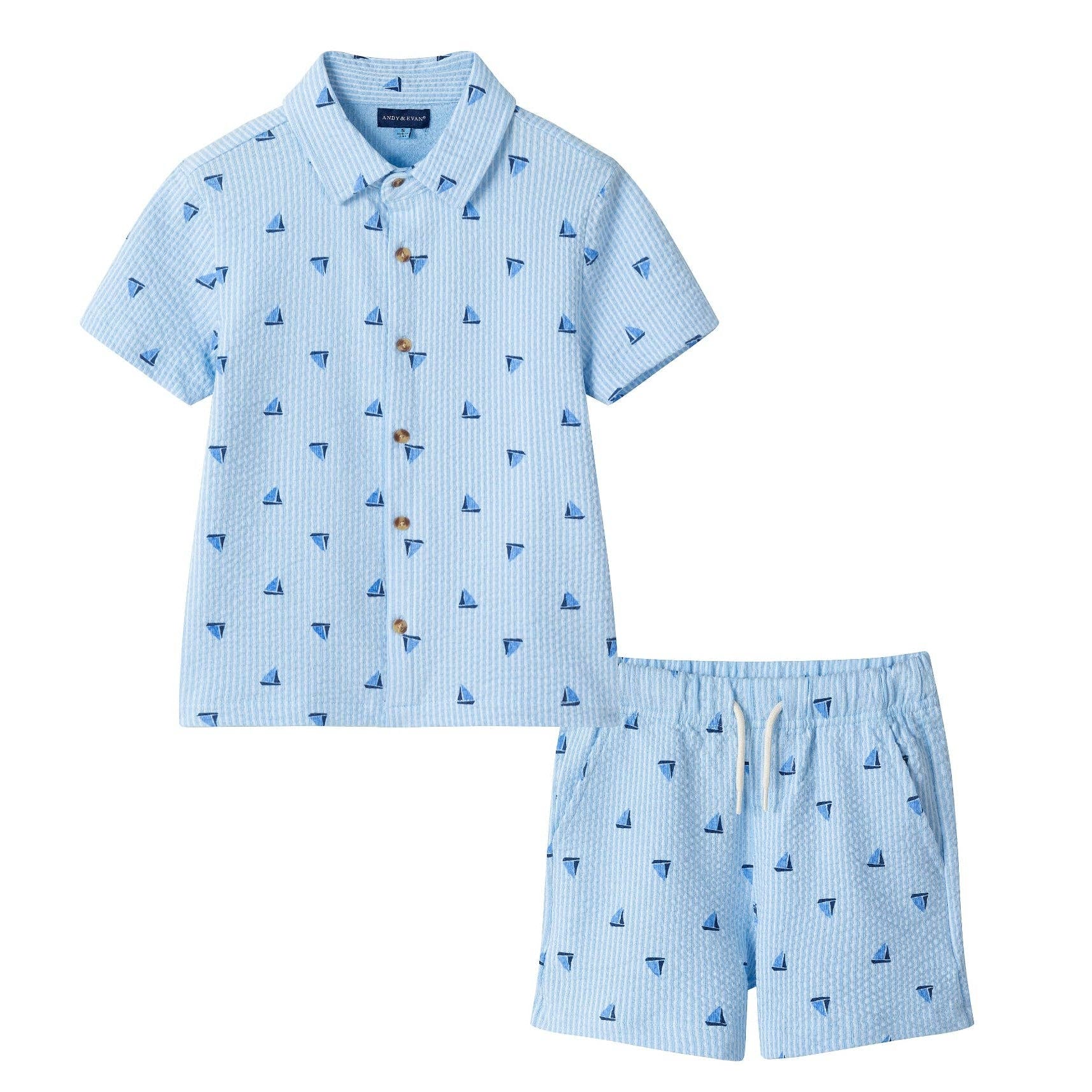 Children's blue checkered shirt and shorts set with sailboat pattern on a white background