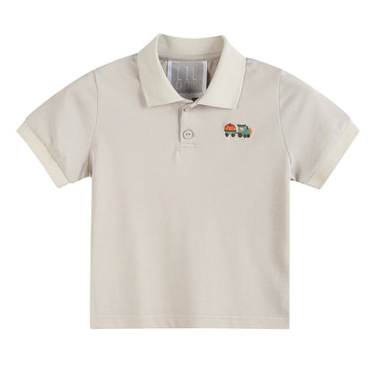 Beige polo shirt with a small embroidered design on a white background