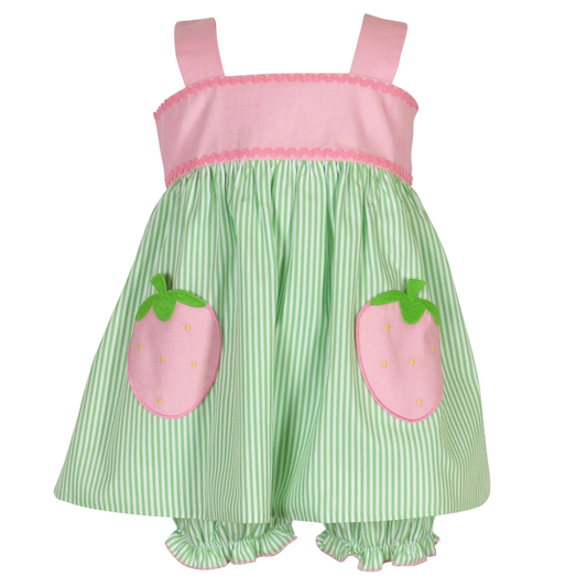 Green and pink dress with strawberry appliqués on a white background